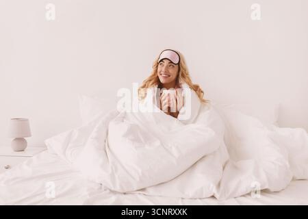 Lady enjoy good morning, weekend and vacation, delicious coffee at free time after great sleep Stock Photo