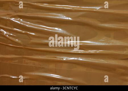 A close-up of a crumpled piece of brown adhesive tape. Stock Photo