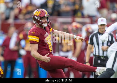 Washington Commanders kicker Matt Gay (16) kicks the ball during an NFL ...