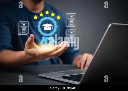 Man holding digital certificate icon with graduation cap, symbolizing online learning achievement. Concept of e-learning, remote education, and profes Stock Photo