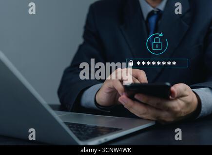 Modern cybersecurity concept, businessman entering password on smartphone, emphasizing encrypted data, internet privacy, secure login and digital prot Stock Photo