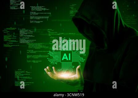 Cybersecurity and AI hacking concept. A hooded hacker controls artificial intelligence chip in dark green tech background. Ideal for cybercrime, AI th Stock Photo