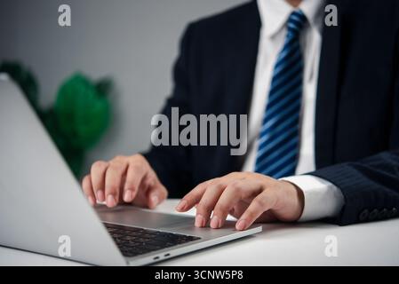 hands typing on laptop computer. Concept of work focus, remote job, or programming technology digital transformation, and smart work solutions. online Stock Photo
