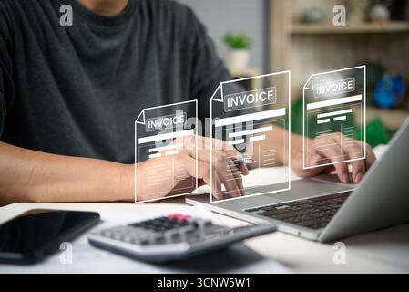 Man working on laptop hands managing electronic invoices with futuristic interface, fintech online payment, accounting software, and financial managem Stock Photo