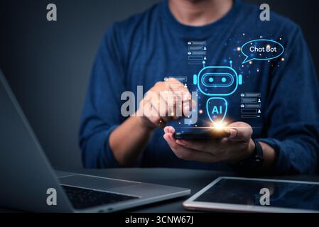 Man hand holding mobile phone showing AI chatbot interface. Concept of artificial intelligence, customer support automation, and virtual assistant tec Stock Photo