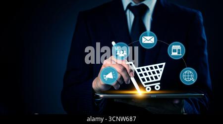 Businessman using digital tablet with e-commerce icons, modern online shopping, digital marketing strategy, and retail concept in a futuristic interfa Stock Photo