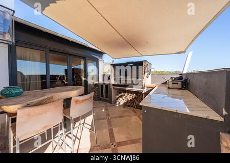 Outdoor Barbecue Area on a Modern Patio in luxury mediterranean apartment Stock Photo