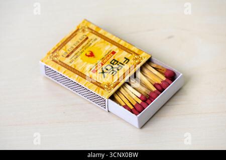 A firebox match with match sticks on wooden background Stock Photo