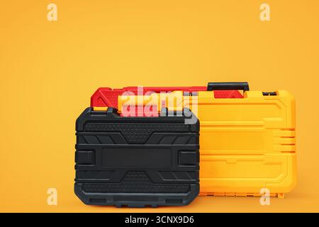 Three sturdy, vibrant-colored plastic toolboxes arranged on a bright orange backdrop, showcasing their durable design and practical storage capabiliti Stock Photo