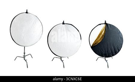 Collection set of silver collapsible reflectors on a stand isolated over a white background Stock Photo