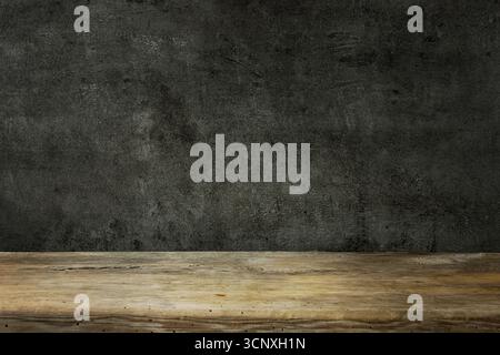wooden table and dark black wall Stock Photo