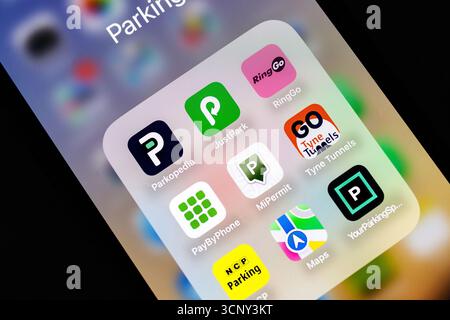 iphone Smartphone screen displaying several parking and navigation apps including Parkopedia and RingGo on a colorful background Stock Photo