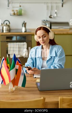 Remote language teacher engages with her students through laptop while working from home. Stock Photo