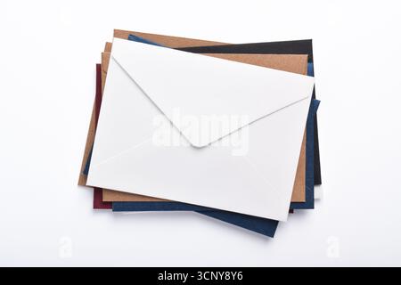 Stack of different paper envelopes on white background, top view Stock Photo