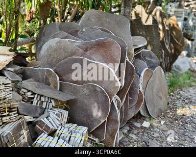 Piles of Natural Stone Slabs and tiles for flooring, paving, and decorative construction Stock Photo