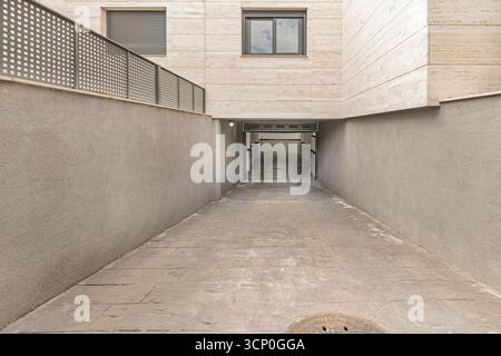 garage with  independent automatic doors, space for tools, and natural ventilation via overhead vents Stock Photo