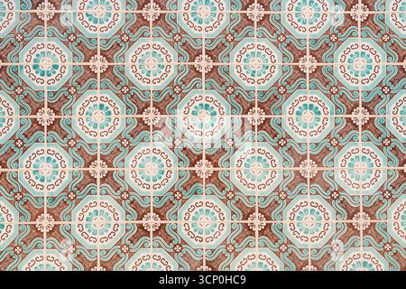 Repeating geometric design with turquoise, brown, and white floral motifs on ceramic tiles. Stock Photo