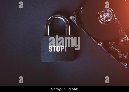 Saving user data. Hacking a password on a PC. Closing access to files. Hackers and secret data. HDD and key with lock.. Stock Photo
