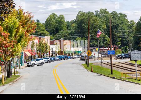 Saluda, North Carolina, USA-7 September 2025: Wide angle view down Main Street, with buildings on left, railroad tracks and "Saluda Grade" sign Stock Photo