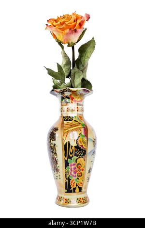 One beautiful yellow rose in chinese ceramic vase isolated on white background Stock Photo