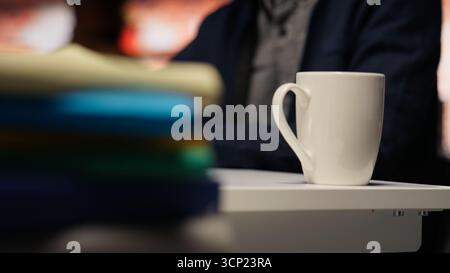 Senior engineer coding advanced AI algorithm in startup office, refining machine learning models to enhance automation. Asian CTO manager using coding platform in Silicon Valley workplace, close up Stock Photo