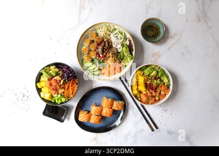An assortment of well-served Chinese food. Chinese noodles, fried rice, dumplings, pedestrian duck, dim sum, spring rolls. Famous Chinese cuisine on t Stock Photo