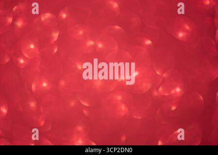 Defocus light glitter red. Abstract blurred background of red sparkles Stock Photo