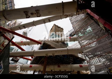The 700-year-old tower of All Hallows Staining church is elevated on stilts during the 'Bottoming Out' ceremony of the new Fifty Fenchurch Street development in central London. Over 125,000 tonnes of earth has been removed underneath and around the medieval church tower to make way for the development of a new 650,000 sq ft 36-story office tower on the site, where the tower will form the center piece of a new public space. Picture date: Tuesday September 23, 2025. Stock Photo