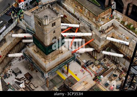 The 700-year-old tower of All Hallows Staining church is elevated on stilts during the 'Bottoming Out' ceremony of the new Fifty Fenchurch Street development in central London. Over 125,000 tonnes of earth has been removed underneath and around the medieval church tower to make way for the development of a new 650,000 sq ft 36-story office tower on the site, where the tower will form the center piece of a new public space. Picture date: Tuesday September 23, 2025. Stock Photo