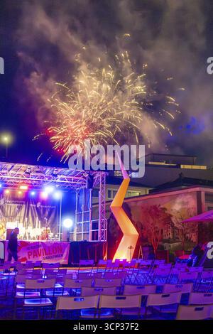 A colourful firework display over an illuminated stage at a night-time event, Fire Night, Sindelfingen, Germany Stock Photo