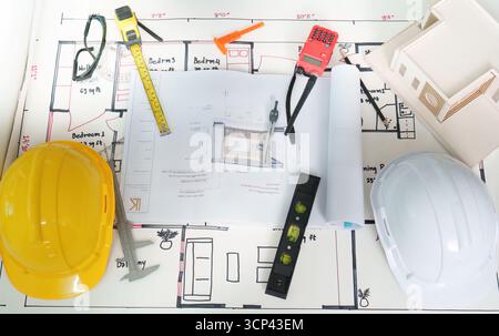 Construction plans and tools on a table for engineering project Stock Photo
