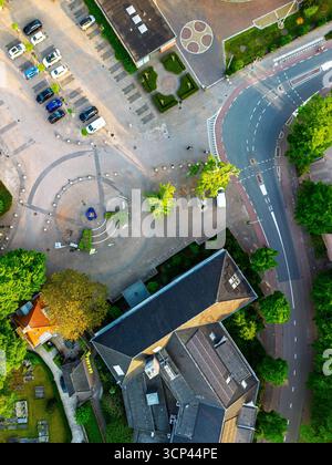 Aerial view of a modern paved parking lot with designated spaces ...