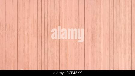 Apricot-colored painted wooden wall made of vertical boards Stock Photo