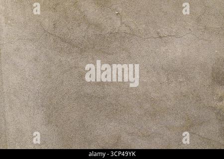 A grey and white background with a few small dots. The background is a mix of grey and white, with some areas being darker than others. The dots are s Stock Photo