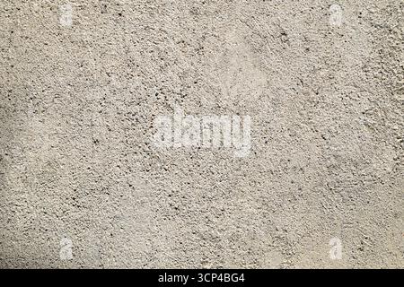 A white background with a few small rocks scattered around. The rocks are of different sizes and shapes Stock Photo