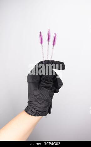 Against a light background, a set of hygienic eye makeup brushes, a place for text Stock Photo