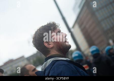 Police officer and a protester clash during the overnight clearance of ...
