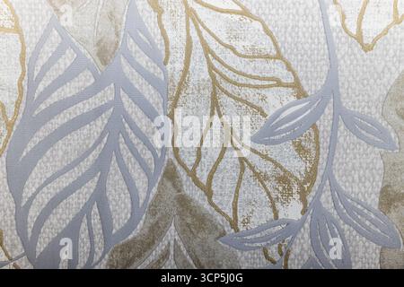 Textured Botanical Wall Covering with Metallic Accents and Tropical Leaf Outlines Stock Photo
