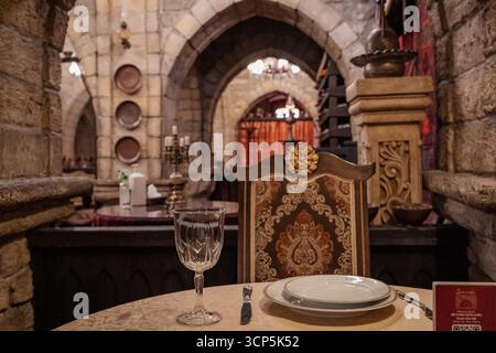 able at Shirvanshahs Museum Restaurant in Baku, Azerbaijan. Authentic atmosphere with traditional Azerbaijani culture and historic setting. Stock Photo
