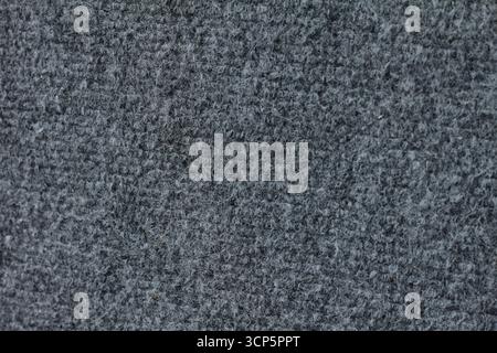 The gray background is made of fabric that has a coarse fibrous structure. Stock Photo