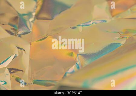 An abstract digital artwork with iridescent, metallic shapes, creating a sense of movement and depth, suitable for luxury advertising or futuristic te Stock Photo