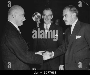 Greetings Across the WorldFrance's foreign Minister, Robert Schuman (left) shakes hands with Australia's Foreign Minister Richard G. Casey (right), while Britain's Foreign Secretary , Anthony Eden (center) beams. Meeting occurred Nov. 10 at the United Nations Headquarters in New York. November 11, 1952. (Photo by Associated Press Photo) Stock Photo