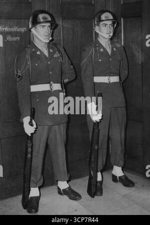 Behind Closed Doors -- The armed guard at the closed doors of the