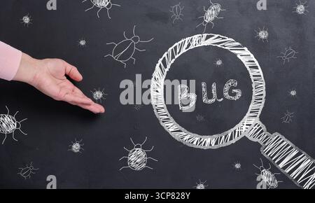 The process of finding and fixing bugs in software code. Stock Photo