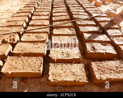 Traditional Mud bricks drying in the sun in the Sahara Desert of Morocco Stock Photo