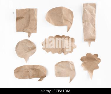 Crumpled brown paper speech bubbles for creative design and communication projects Stock Photo