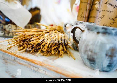Crafting materials and tools arranged on a rustic table in a creative workspace Stock Photo