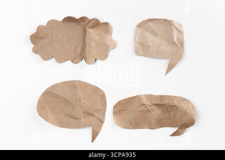 Creative paper speech bubbles arranged on a white background for communication concepts Stock Photo