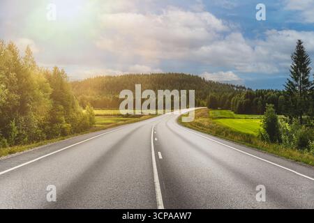 Winding road through the scenic landscape of Finland Stock Photo