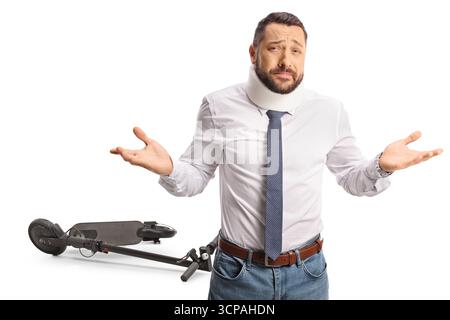 Injured man with a cervical collar gesturing with hands in front of an electric scooter isolated on white background Stock Photo